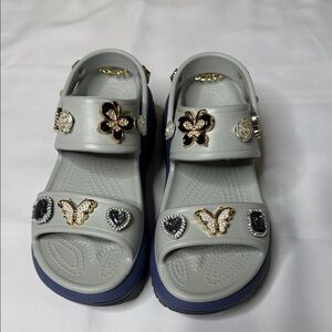 Stylish Crocs Mega Crush platform sandals with charms
